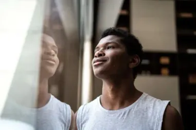 teenage-boy-reflection-window